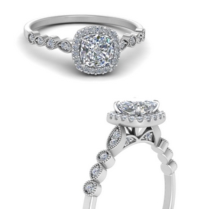 delicate cushion shaped halo diamond engagement ring