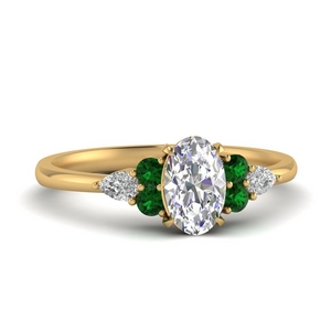 oval diamond with emerald side stones